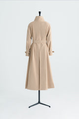 Tailored wool blend trench coat with oversized lapels and structured belted waist