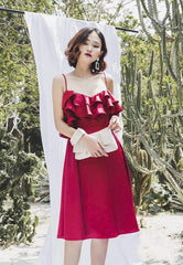 Sleeveless silk midi dress with ruffled bodice and flared hem for summer occasions