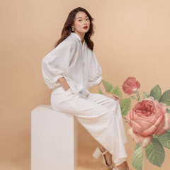 Relaxed-fit silk blouse with voluminous sleeves and open V-neckline for effortless elegance