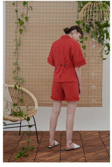 High-Waisted Linen Shorts with Frayed Hem and Button Detailing