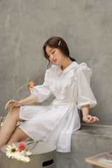 Silk dress with ruffled bib detail and puff sleeves in a structured A-line silhouette