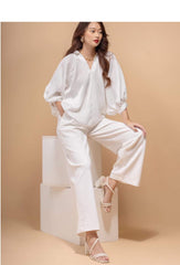 Relaxed-fit silk blouse with voluminous sleeves and open V-neckline for effortless elegance