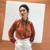 Silk blouse with tie-neck detail and long sleeves for an elegant and polished silhouette