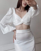 Silk blouse with twist-front design and voluminous sleeves for modern feminine styling