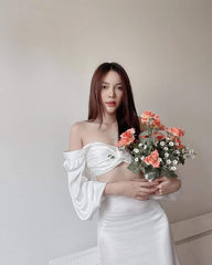 High-waisted silk midi skirt with side slit and figure-flattering tailored silhouette