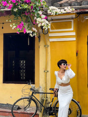 High-waisted midi silk skirt with side slits and sleek tailored silhouette for elevated style