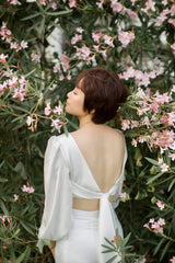 High-waisted midi silk skirt with side slits and sleek tailored silhouette for elevated style