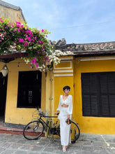 Silk blouse with draped twist front and voluminous sleeves for elegant day-to-night styling