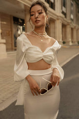 High-waisted silk midi skirt with side slits and sleek tailored silhouette for modern elegance