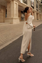 High-waisted silk midi skirt with side slits and sleek tailored silhouette for modern elegance