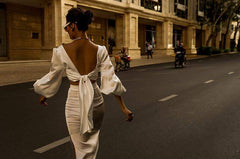 High-waisted silk midi skirt with side slits and sleek tailored silhouette for modern elegance