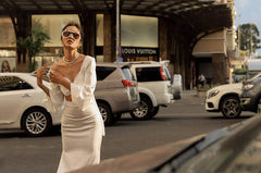 High-waisted silk midi skirt with side slits and sleek tailored silhouette for modern elegance