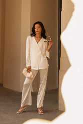 Relaxed-fit silk blouse with long sleeves and wrap front design for effortless elegance