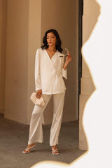 Relaxed-fit silk blouse with long sleeves and wrap front design for effortless elegance