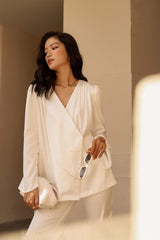 Relaxed-fit silk blouse with long sleeves and wrap front design for effortless elegance