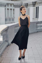 Silk midi skirt with flowing silhouette and high-waist design for timeless feminine elegance
