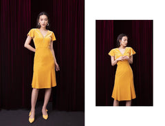 Velvet midi dress with flutter sleeves, pearl button detail and flared hem for refined occasions