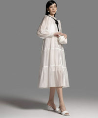 Tiered Organza Midi Dress with Sheer Long Sleeves and Contrast Neck Tie Detail