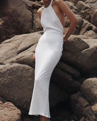 Elegant halter-neck velvet dress with open back and slim silhouette for formal evening occasions