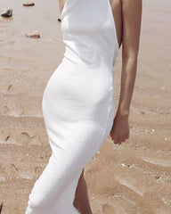 Elegant halter-neck velvet dress with open back and slim silhouette for formal evening occasions