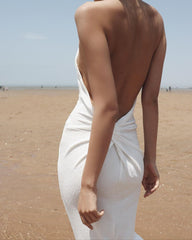 Elegant halter-neck velvet dress with open back and slim silhouette for formal evening occasions