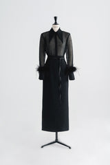 High-waisted textured skirt with back slit and sleek tailored silhouette
