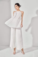 Pleated halter silk top with flowy silhouette and gathered waist detail