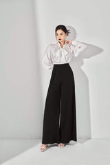 Chemisier en soie boutonné avec détail cravate et manches volumineuses pour une élégance sans effort