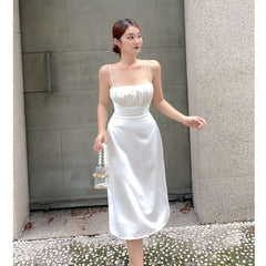 Silk midi dress with ruched bust and adjustable straps, featuring a sleek fitted silhouette