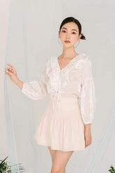 Sheer organza blouse with ruffle trim and voluminous balloon sleeves