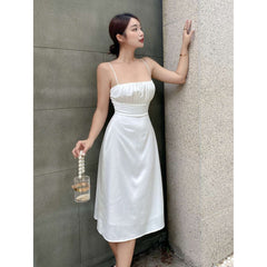 Silk midi dress with ruched bust and adjustable straps, featuring a sleek fitted silhouette