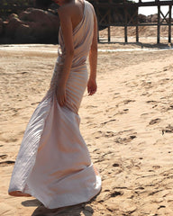 Velvet pleated one-shoulder gown with ruched waist and flowing asymmetric hemline