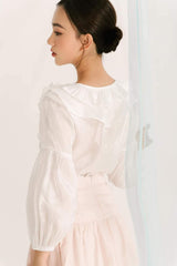 Sheer organza blouse with ruffle trim and voluminous balloon sleeves