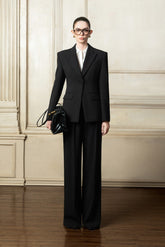 Tailored structured blazer with sharp shoulders and sculpted waist for elevated styling