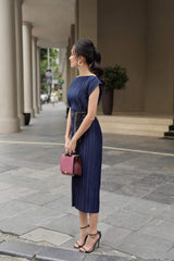 Pleated silk midi dress with boat neckline and waist-defining sash belt for elegant styling