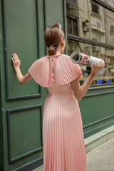Sleeveless pleated midi silk dress with structured cape and cinched waist