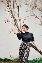 Structured silk blouse with short flared sleeves and high neckline for elegant styling