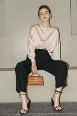 Tailored silk wide-leg pants with high-rise waist and pleated front for elegant drape