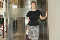 Short-sleeve silk blouse with boat neckline and belted waist for a sculpted silhouette