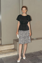 Short-sleeve silk blouse with boat neckline and belted waist for a sculpted silhouette