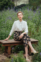 Silk button-down blouse with relaxed fit and cropped sleeves for versatile everyday wear