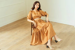 Silk midi dress with puffed sleeves and tiered skirt for soft volume and feminine elegance