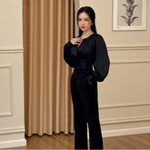 Silk blouse with voluminous long sleeves and fitted waist detail for elegant evening styling