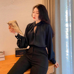 Tailored silk pants with high-rise waist and sleek straight-leg silhouette for elevated styling