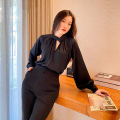 Tailored silk pants with high-rise waist and sleek straight-leg silhouette for elevated styling