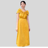 Off-shoulder silk midi dress with knotted front detail and elegant A-line silhouette