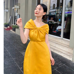 Off-shoulder silk midi dress with knotted front detail and elegant A-line silhouette