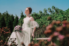 Robe longue en tulle à manches bouffantes et col Bardot Katrina