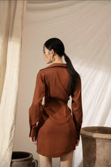 Silk shirt dress with tie-front draping and collared neckline for contemporary elegance