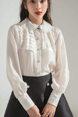 Silk A-line skirt with pearl button accents and structured silhouette for elevated daywear